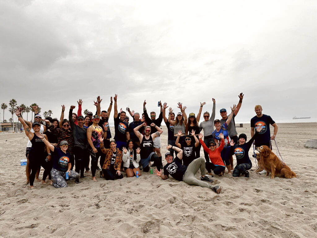 group of people on the beach for the burpee mile in Los Angeles california
